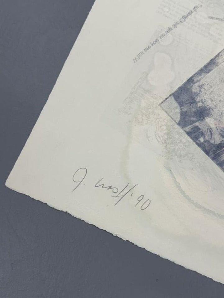 Close-up of a textured paper with a signature and date on a dark blue background